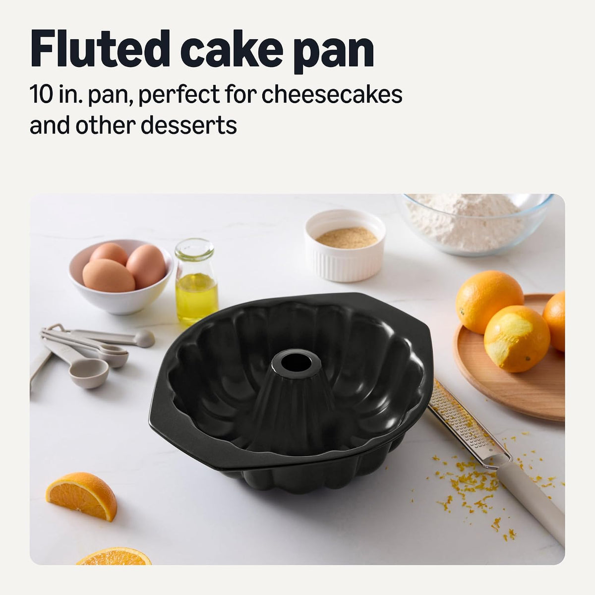 Amazon Basics Nonstick Bundt Cake Pan, Fluted Tube Design, Carbon Steel, Side Handles, Dishwasher and Oven-Safe, 10 Inch, Black